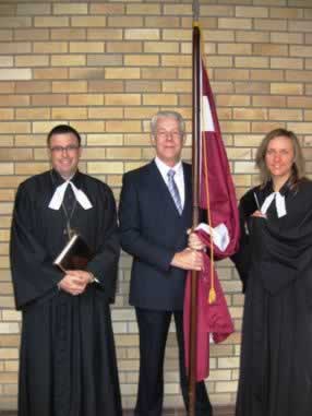 Pastor and flag bearer